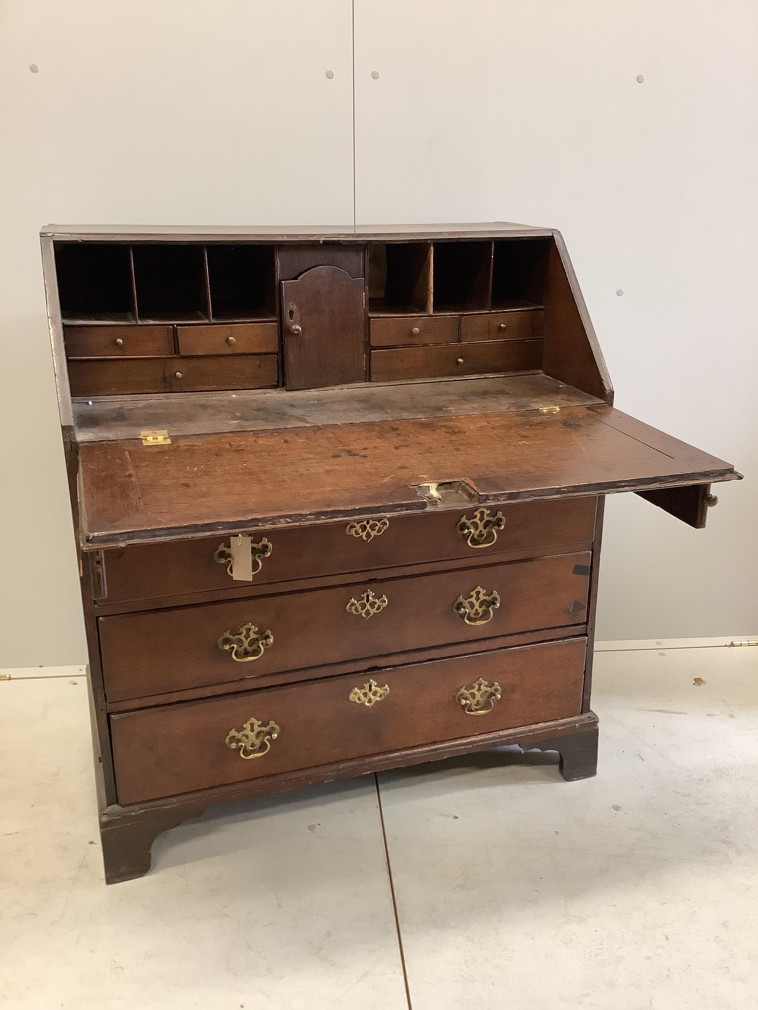 A George III oak bureau, width 91cm, depth 51cm, height 105cm